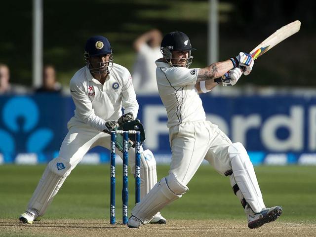 Brendon McCullum (R) of New Zealand bats as MS Dhoni looks on during Day 4 of the 2nd Test at the Basin Reserve in Wellington. (AFP Photo)