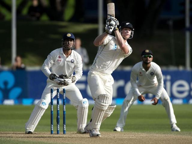 Jimmy Neesham (C) of New Zealand bats as MS Dhoni (L) and Mohammed Shami (R) lood on during Day 4 of the 2nd Test at the Basin Reserve in Wellington. (AFP Photo)