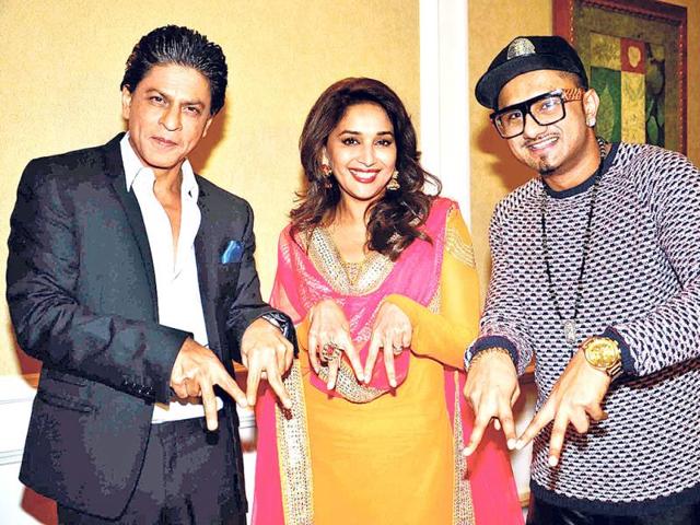 Shah Rukh Khan, Madhuri Dixit and Yo Yo Honey Singh pose for shutterbugs ahead of their performance in Malaysia.
