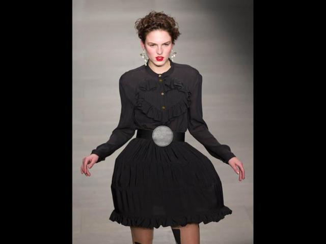 A model presents a creation from Vivienne Westwood Red Label during the 2014 Autumn/ Winter London Fashion Week in London. (AFP)