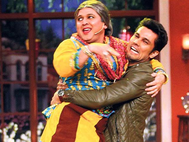 Randeep Hooda shows off his muscle power by lifting an actor on the sets of Comedy Nights with Kapil.