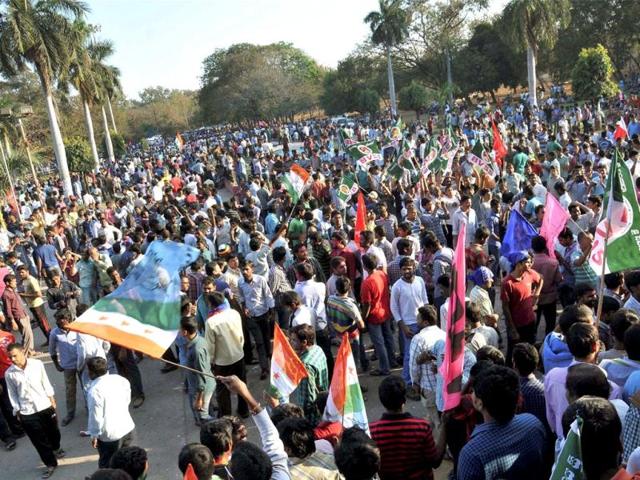 Students at Osmania University celebrate the passage of Telangana bill in the Lok Sabha in Hyderabad.(PTI photo)