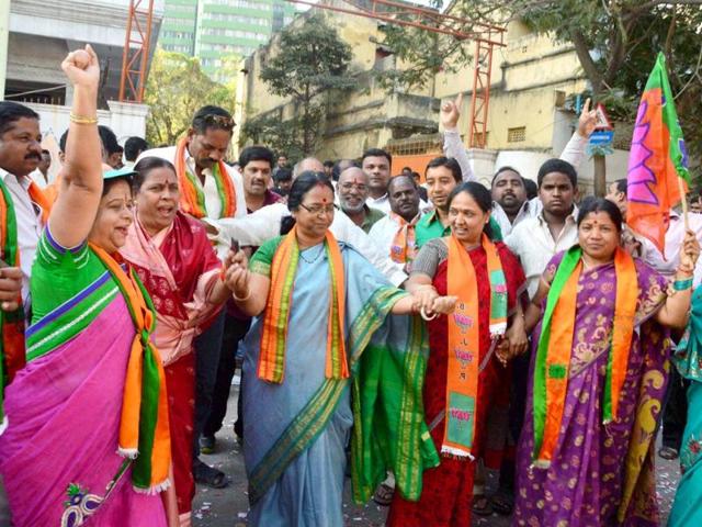 BJP leaders and workers dance as they celebrate the passage of Telangana bill in the Lok Sabha in Hyderabad. (PTI photo)