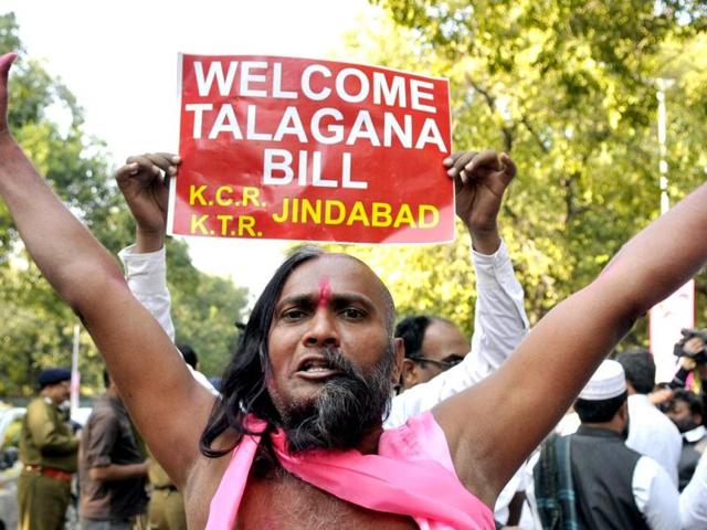 Telangana supporters celebrate the passage of Telangana bill in the Lok Sabha. (HT photo/Mohd. Zakir)