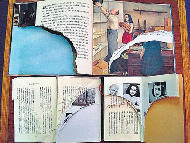 Ripped-pages-of-three-books-of-Anne-Frank-s-Diary-of-Young-Girl-are-displayed-at-a-library-in-Tokyo-AFP-photo