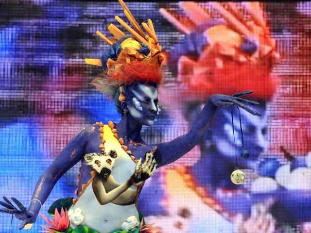 A body-painted model displays a creation during an art show as part of the International Beauty Expo 'Nevskie Berega' (Neva River Banks) in St Petersburg. (AFP)