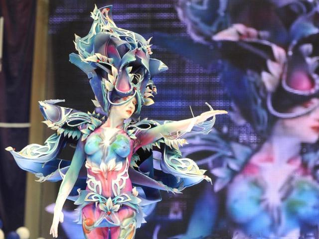 A body-painted model displays a creation during an art show as part of the International Beauty Expo 'Nevskie Berega' (Neva River Banks) in St Petersburg. (AFP)