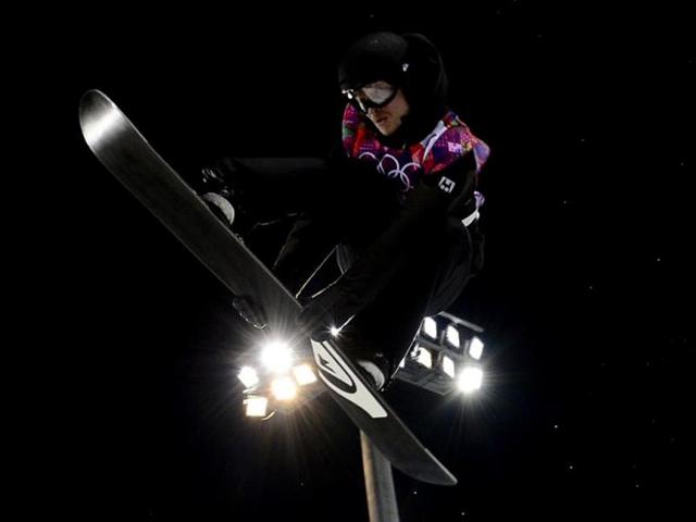 Switzerland's Iouri Podladtchikov competes in the Men's Snowboard Halfpipe Final at the Rosa Khutor Extreme Park during the Sochi Winter Olympics. AFP PHOTO
