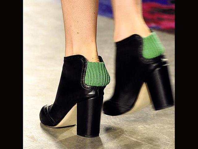 These quirky shoes from Thakoon’s show at New York Fashion Week Fall 2014were much talked about. The pops of green or pink wool at the back, will not only keep you warm but add style nevertheless.