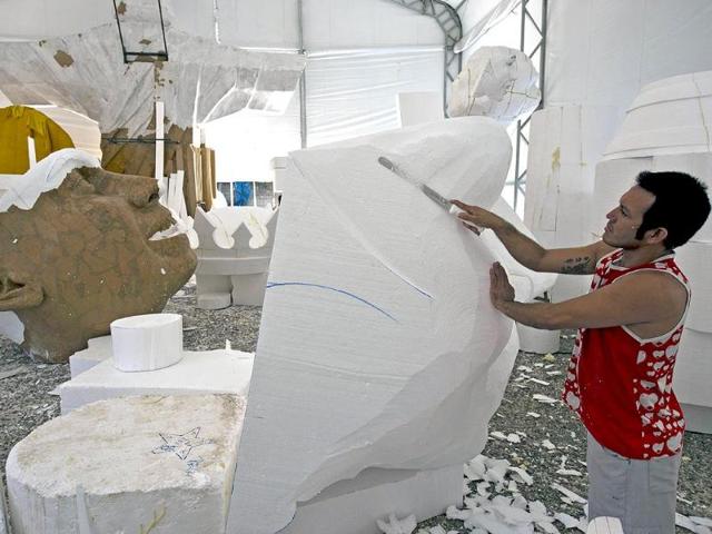 A member of the Gavioes da Fiel samba school works on a float in Sao Paulo, Brazil. Gavioes da Fiel's theme for this year's carnival is an homage to Brazilian former football star Ronaldo.(AFP photo)