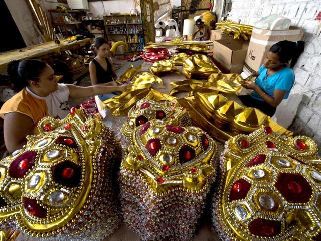 Members of the Gavioes da Fiel samba school work on costumes in Sao Paulo, Brazil. Gavioes da Fiel's theme for this year's carnival is an homage to Brazilian former football star Ronaldo.(AFP photo)