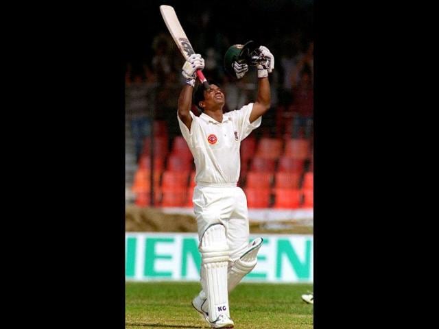 File-Photo-Bangladesh-s-Aminul-Islam-celebrates-after-hitting-a-century-on-11-November-2000-at-the-Bangabandhu-National-Stadium-on-the-second-day-of-Bangladesh-s-inaugural-Test-against-India-AFP-Photo