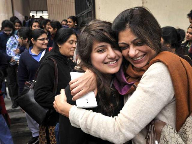 Student of 12th class hugs by her mother as she come out after appearing for English Language Paper in the CBSE Board Exams, in New Delhi. (Sushil Kumar/HT Photo)