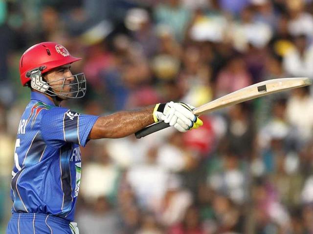 Afghanistan's Samiullah Shenwari celebrates after scoring a half century against Bangladesh during their Asia Cup match in Fatullah. (Reuters Photo) Afghanistan's Samiullah Shenwari celebrates after scoring a half century against Bangladesh during their Asia Cup match in Fatullah. (Reuters Photo)