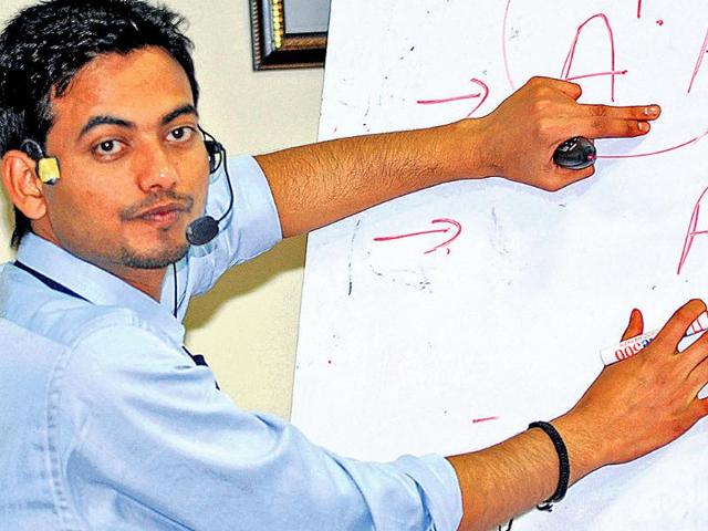 Assistant-professor-Arvind-Mishra-on-the-first-day-of-his-during-his-5-day-non-stop-lecture-in-Dehradun-on-Saturday-Rish-Ballabh-Hindustan-Times