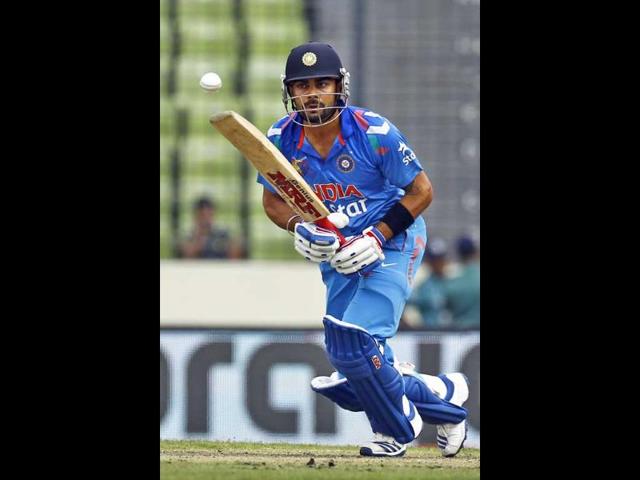 Virat Kohli plays a shot during the Asia Cup match against Pakistan in Mirpur. (AP Photo) 