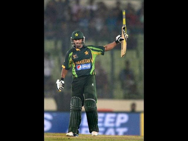 Pakistani batsman Mohammad Hafeez celebrates after scoring a half-century during the sixth match of the Asia Cup against India at the Sher-e-Bangla National Cricket Stadium in Mirpur. (AFP Photo) 