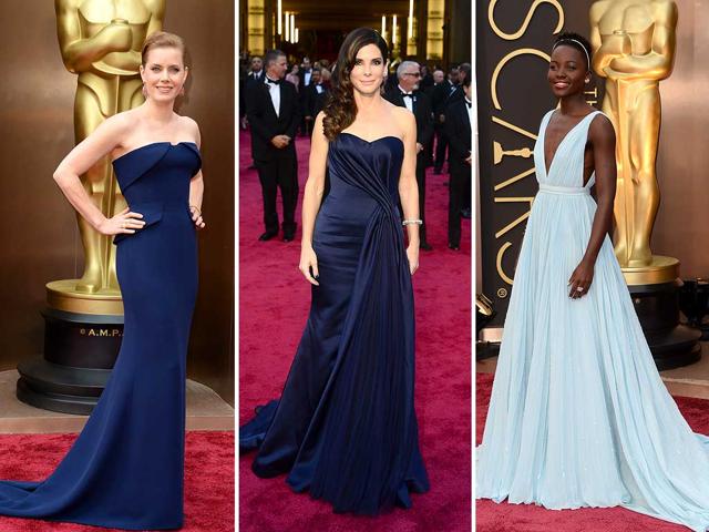 Amy Adams eschewed her American Hustle style and opted for an elegant navy blue Gucci gown, while Gravity star Sandra Bullock looked classy and elegant in a navy blue Alexander McQueen gown. Lupita Nyong'o kept her red hot red carpet streak going strong by showing up in a cool ice blue silk Prada gown. (AFP) Amy Adams eschewed her American Hustle style and opted for an elegant navy blue Gucci gown, while Gravity star Sandra Bullock looked classy and elegant in a navy blue Alexander McQueen gown. Lupita Nyong'o kept her red hot red carpet streak going strong by showing up in a cool ice blue silk Prada gown. (AFP)