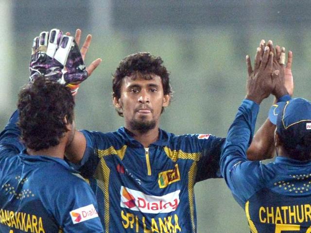Sri Lankan bowler Suranga Lakmal (C) and teammates celebrate the wicket of Afghan batsman Samiullah Shenwari during the seventh match of the Asia Cup at the Sher-e-Bangla National Cricket Stadium in Mirpur. (AFP Photo)