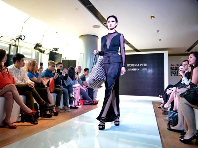 A model presents creation by Malaysian designer Jonathan Liang for Roberta Pieri during a media preview for Audi Fashion Festival in Singapore. (AFP) A model presents creation by Malaysian designer Jonathan Liang for Roberta Pieri during a media preview for Audi Fashion Festival in Singapore. (AFP)