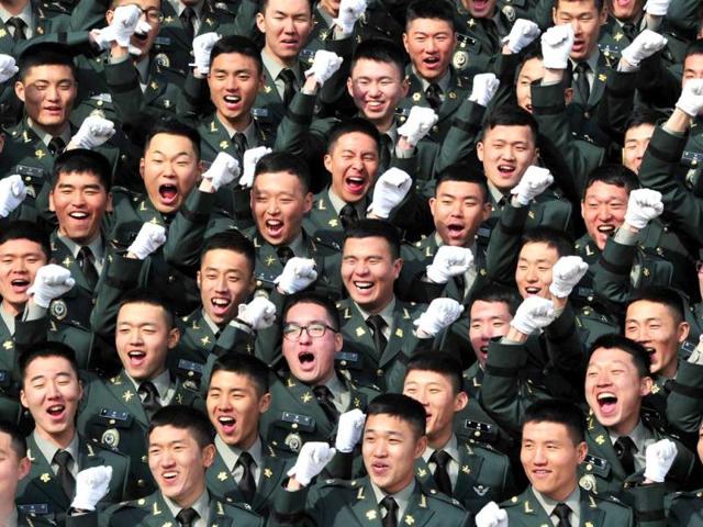 South Korean new military officers cheer during the joint commission ceremony of 5,860 new officers of the army, navy, air force and marines at the military headquarters in Gyeryong, south of Seoul. (AFP Photo) South Korean new military officers cheer during the joint commission ceremony of 5,860 new officers of the army, navy, air force and marines at the military headquarters in Gyeryong, south of Seoul. (AFP Photo)