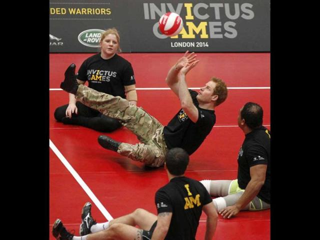Britain's Prince Harry (C) plays a game of sitting volleyball during the launch of the Invictus Games for wounded warriors at the Copper Box arena in the Queen Elizabeth Olympic Park in London. (AP Photo) Britain's Prince Harry (C) plays a game of sitting volleyball during the launch of the Invictus Games for wounded warriors at the Copper Box arena in the Queen Elizabeth Olympic Park in London. (AP Photo)
