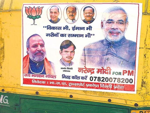 A-poster-of-BJP-s-PM-candidate-Narendra-Modi-on-an-auto-rickshaw-in-New-Delhi-HT-photo A-poster-of-BJP-s-PM-candidate-Narendra-Modi-on-an-auto-rickshaw-in-New-Delhi-HT-photo