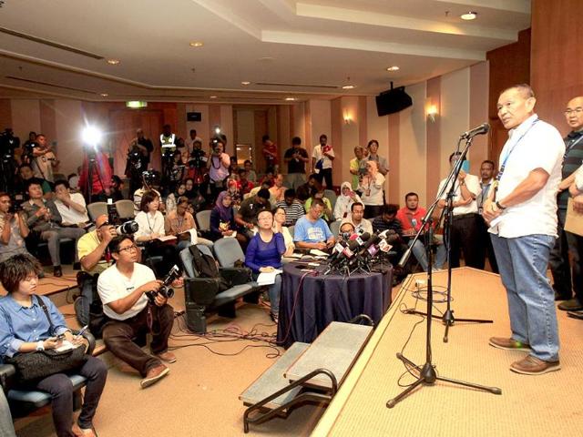 Malaysian Airlines Group Chief Executive Ahmad Jauhari Yahyain, right, speaks during a press conference at a hotel in Sepang, outside Kuala Lumpur, Malaysia.(AP Photo)