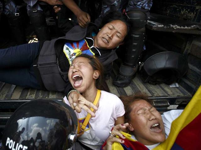 Nepalese police personnel detain Tibetan activists during their protest near the Chinese Embassy Consular office in Kathmandu. (Reuters photo) Nepalese police personnel detain Tibetan activists during their protest near the Chinese Embassy Consular office in Kathmandu. (Reuters photo)
