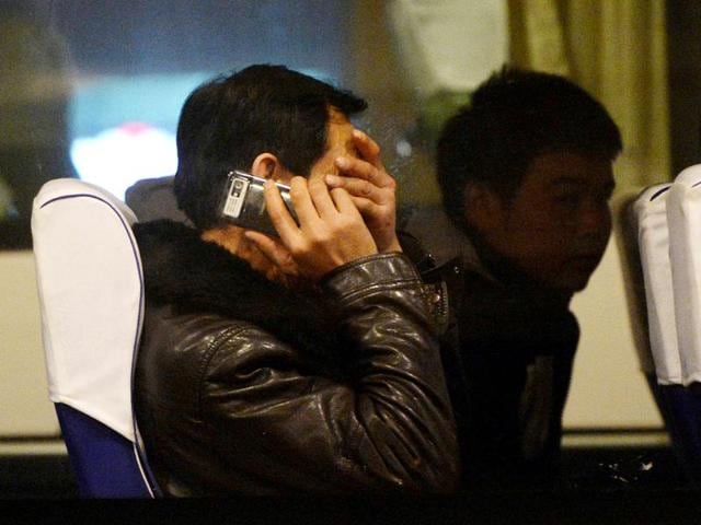 Relatives-of-passengers-from-the-missing-Malaysia-Airlines-Boeing-777-200-plane-wait-inside-a-bus-at-the-Lido-Hotel-in-Beijing-AFP-Photo