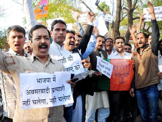 BJP workers protesting outside party office in Allahabad on Tuesday, demanding a local candidate to be fielded from the city in the upcoming LS polls. PTI Photo