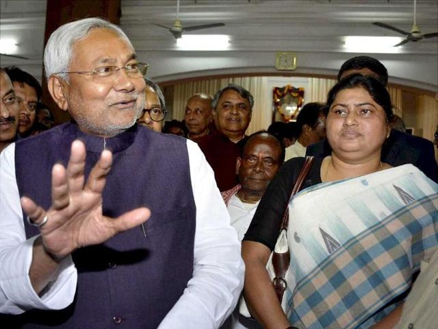 Bihar Chief Minister Nitish Kumar with the newly inducted Cabinet minister Lesi Singh at Raj Bhawan in Patna on Tuesday. PTI Photo