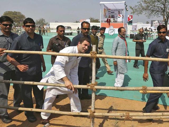 Congress-vice-president-Rahul-Gandhi-C-surrounded-by-his-security-personnel-speaks-to-his-supporters-through-a-barricade-after-addressing-a-rally-at-Balasinor-in-Gujarat-Reuters-photo Congress-vice-president-Rahul-Gandhi-C-surrounded-by-his-security-personnel-speaks-to-his-supporters-through-a-barricade-after-addressing-a-rally-at-Balasinor-in-Gujarat-Reuters-photo