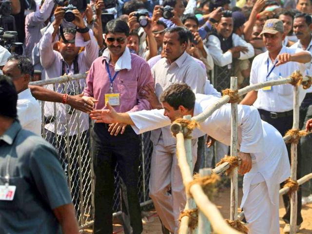 India’s ruling Congress party Vice President Rahul Gandhi, right, stretches out to greet a supporter during an election rally at Balasinor, in the western Indian state of Gujarat. (AP Photo)