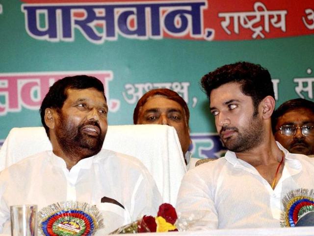 LJP chief Ram Vilas Paswan with his son and party leader Chirag Paswan at a party meeting in Patna (PTI photo)