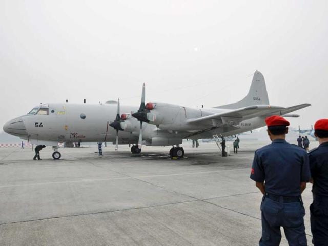 A P3C patrol plane of the Japan Maritime Self-Defense Force sits on the taxi way at Sepang air force base, Malaysia. (AP Photo)