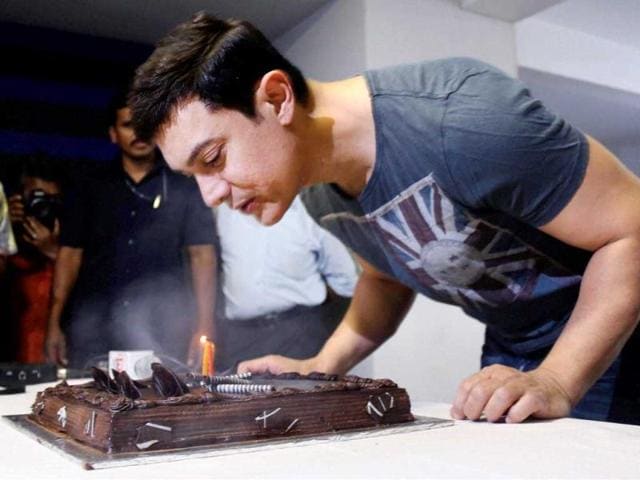 Aamir Khan celebrates his 49th birthday at his home in Mumbai. (PTI Photo)