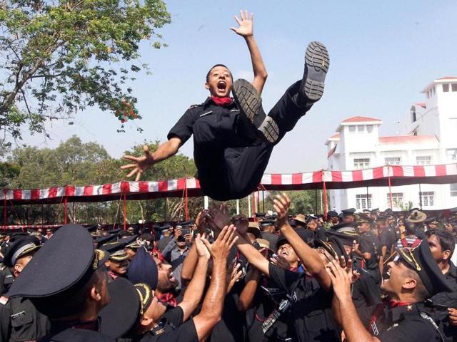 Cadets lift a colleague after a passing out parade at Officers Training Academy in Chennai. (PTI Photo)
