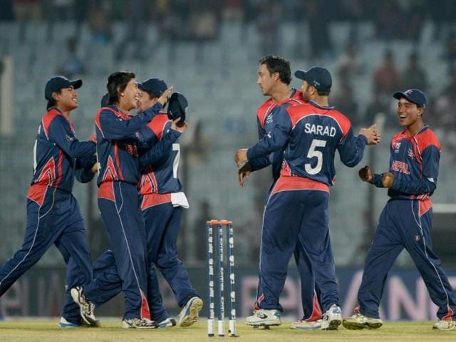 Nepal cricketers celebrate the dismissal of Hong Kong's Irfan Ahmed Naresh Budayair during the ICC World T20 match in Chittagong. (AFP Photo)