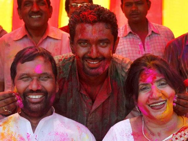 Lok Janshakti Party president Ram Vilas Paswan with his wife and son Chirag Paswan celebrate Holi at his residence in New Delhi. (PTI photo)
