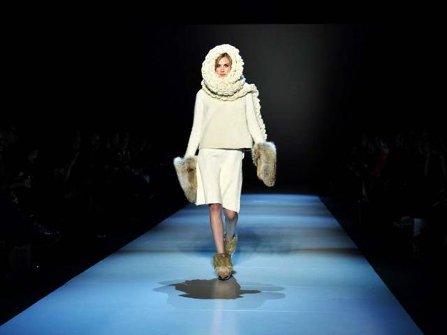 A model shows a creation from Pink Tartan while walking the runway. (AP Photo)