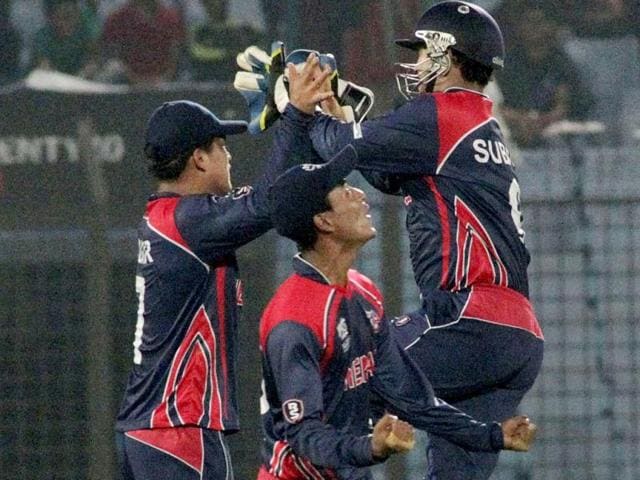 Nepalese cricketers celebrate after defeating Afghanistan by nine runs during their World T20 match in Chittagong. (AP Photo)