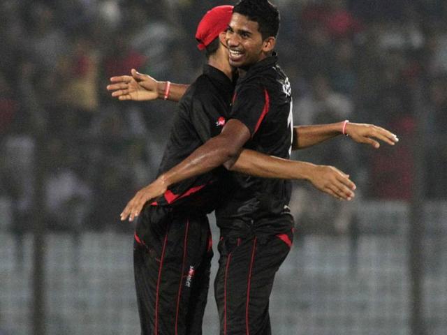 Hong Kong's Nadeem Ahmed (R) celebrates a Bangladeshi wicket during their World T20 match in Chittagong. (AP Photo)