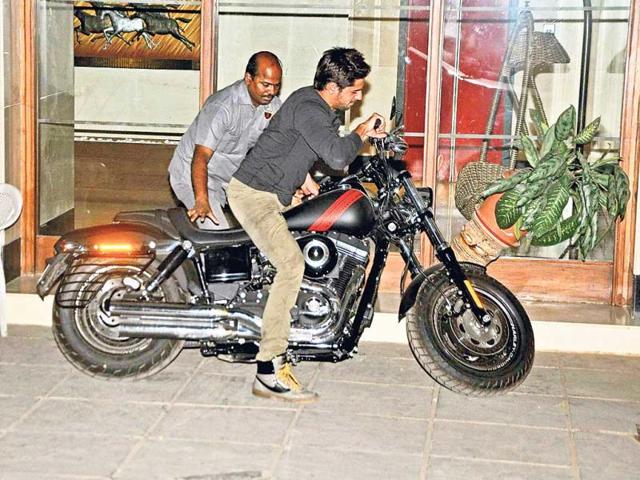 Actor Sidharth Malhotra evidently had a hard time maneouvering his high-end cruiser bike near Karan Johar's residence in Mumbai.