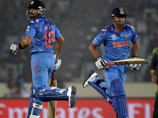 Virat Kohli (L) and Suresh Raina run between the wickets against Pakistan during their match of ICC World Twenty20 World Cup at the Sher-E-Bangla National Cricket Stadium in Dhaka. (Reuters Photo)