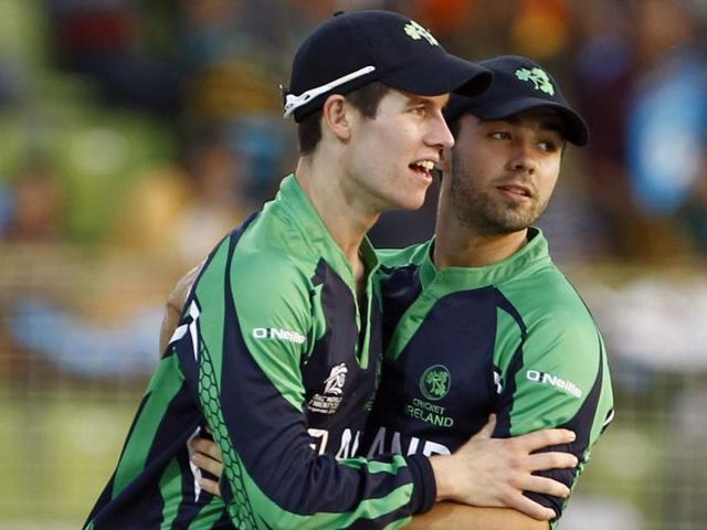 Ireland's George Dockrell (L) and Stuart Thompson celebrate the wicket of Netherlands' Peter Borren during their ICC World Twenty20 match in Sylhet. (AP Photo)