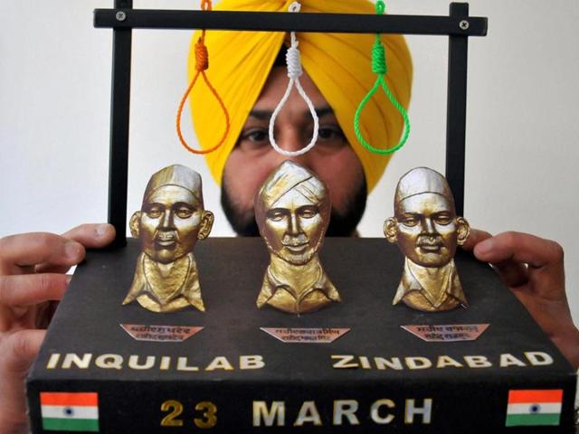 Artist Harwinder Gill displays his new creation paying tribute to martyrs Rajguru, Sukhdev and Bhagat Singh on the eve of their martyrdom in Amritsar (PTI photo) Artist Harwinder Gill displays his new creation paying tribute to martyrs Rajguru, Sukhdev and Bhagat Singh on the eve of their martyrdom in Amritsar (PTI photo)