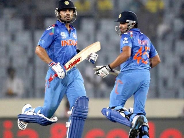 Virat Kohli and Rohit Sharma (R) run between the wickets against West Indies during their ICC World Twenty20 match at the Sher-E-Bangla National Cricket Stadium in Dhaka. (Reuters Photo)