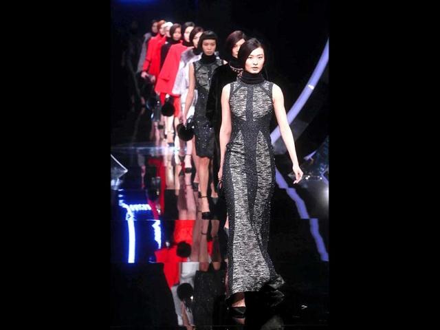 Models sashaying outfits during the China Fashion Week in Beijing. (AFP)
