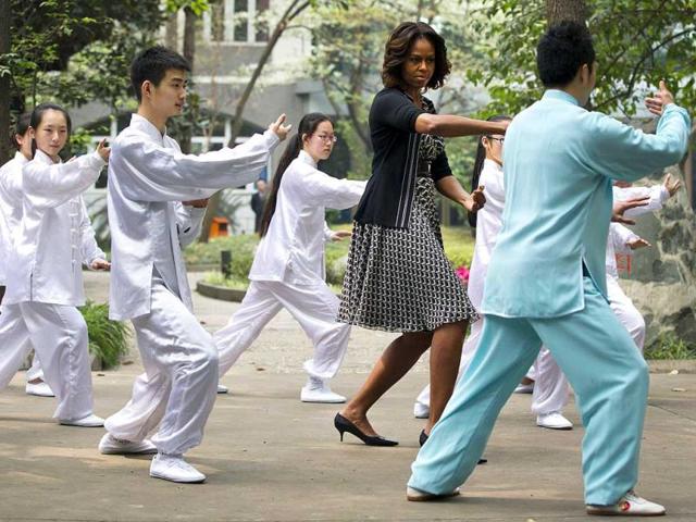 Obama's weeklong trip to China has included opportunities to try out tai-chi, walk the Great Wall and feed the pandas. That’s all to be expected from a first lady soaking up culture while traveling abroad. (AP)